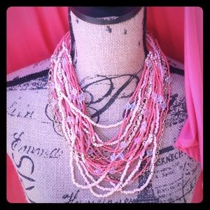 Multi-strand coral and gold tone beaded necklace